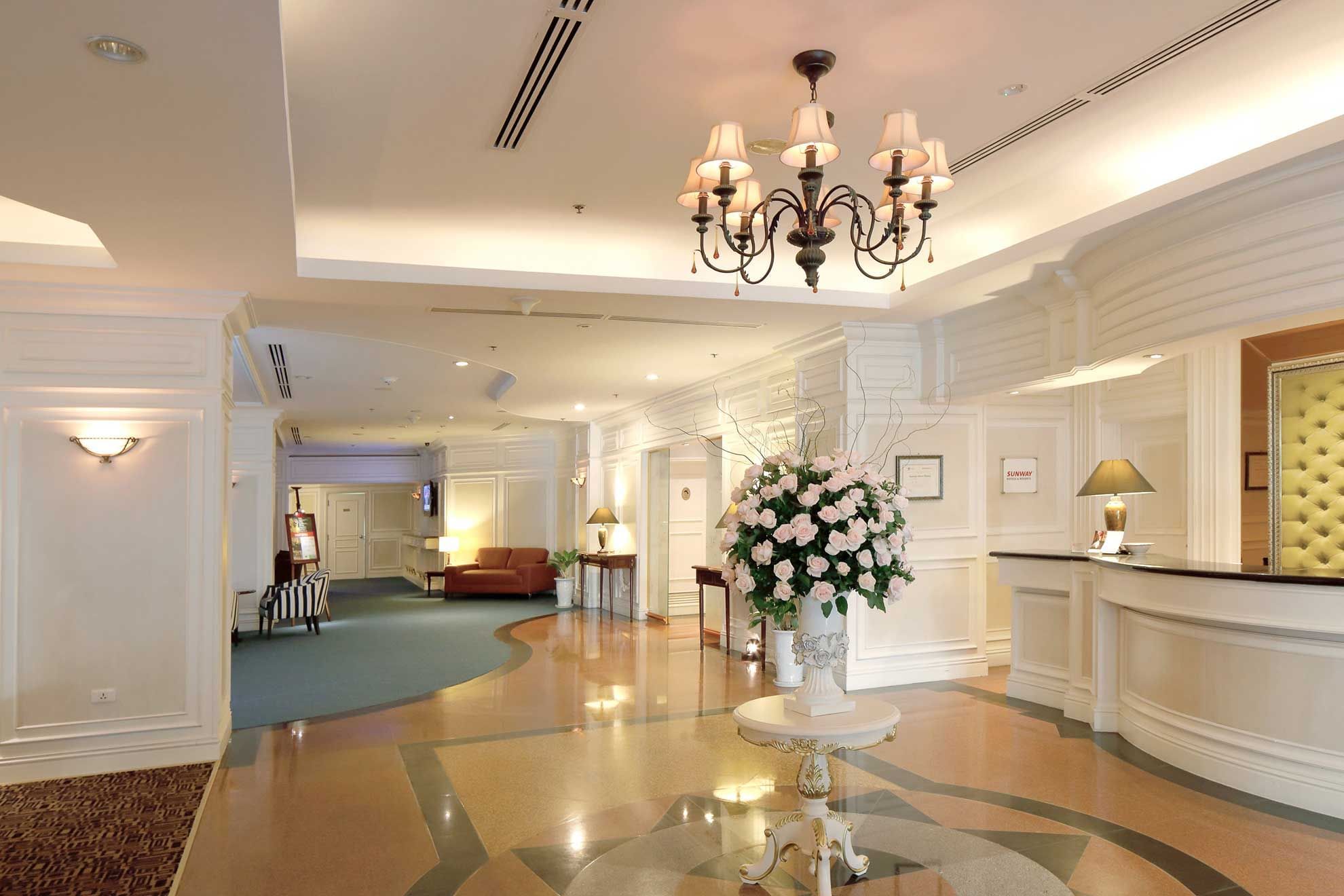 A bouquet in a vase by the reception front desk at Sunway Hotel Hanoi